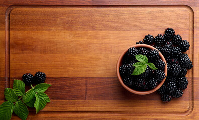 black ripe blackberries on wooden tray blackberries close up