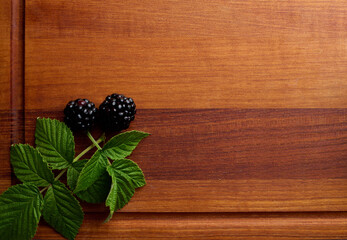 black ripe blackberries on wooden tray blackberries close up