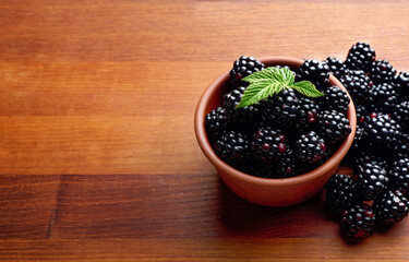 black ripe blackberries on wooden tray blackberries close up
