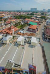 Aerial drone view of historical Malacca City with many buildings at Melaka, Malaysia.