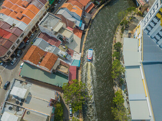 Aerial drone view of big and dense Malacca City with Malacca River at Melaka, Malaysia.