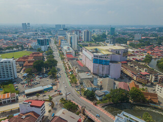 Aerial drone view of big and dense Malacca City with Malaysian settlements at Melaka, Malaysia.