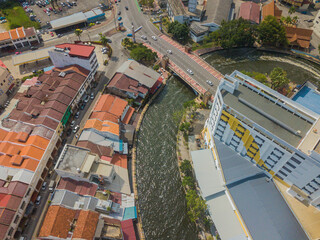 Fototapeta premium Aerial drone view of big and dense Malacca City with Malacca River at Melaka, Malaysia.
