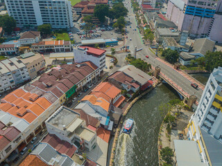 Aerial drone view of big and dense Malacca City with Malaysian settlements at Melaka, Malaysia.