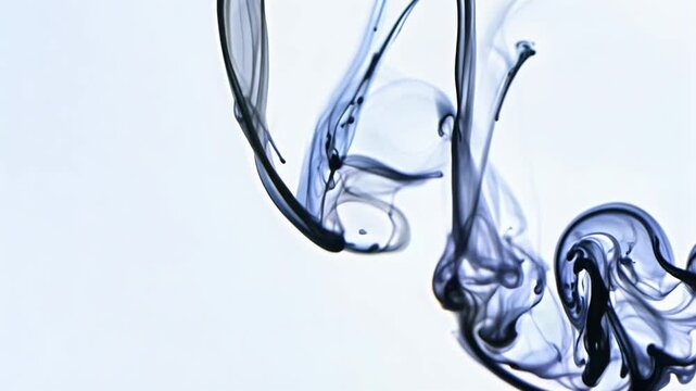 The image is of smoke, which is a type of vapor that is produced when something burns. The smoke is swirling and twisting in the air, creating a sense of movement and energy.