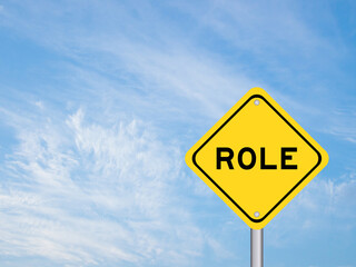 Yellow transportation sign with word role on blue color sky background