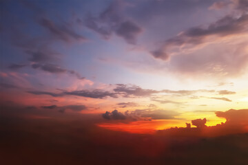 Dramatic panoramic aerial view of colorful twilight sky and clouds with bright light from summer tropical sunset atmosphere. Image use for meteorology forecast presentation background.