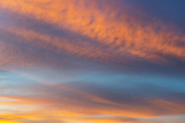 summer evening, sunset in yellow, orange and pink with clouds, background