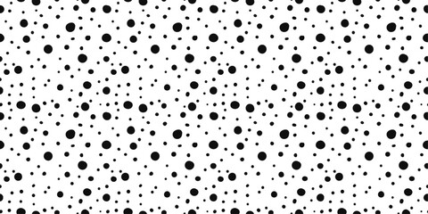 Obraz premium Small black dots on a white background. Monochrome pattern of circle dots.