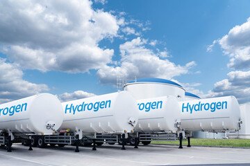 Hydrogen tank trailers stand in a row. Clean fuel concept