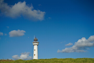 Netherlands Egmond aan Zee Van Speijk Lighthouse with blue sky