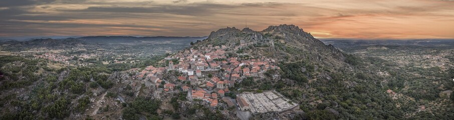 Aerial panoramic view of Monsanto, Portugal on a mountaintop at sunrise