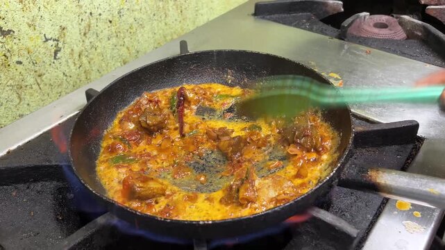 Cooking of mutton in South Indian style with coconut oil