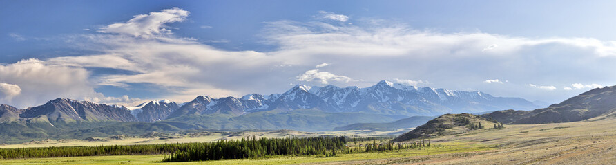 high snow mountains panorama under white cloudy sky