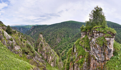 rocks in the Caucasus mountain under grey clouds