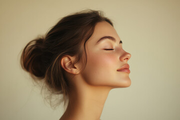 Fototapeta premium A close up of a girl's face with her eyes closed