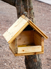 Bird feeder made from tongue and groove floorboards