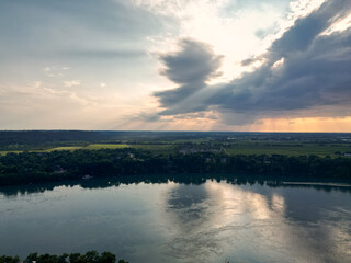 Aerial of Niagara-on-the-Lake and Queenston region of Ontario over the Niagara River from Lewiston, New York, crossing an international border to Canada. Shot on a rainy afternoon summer day, 2024.