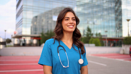 Beautiful, young female doctor enjoying her break outdoors
