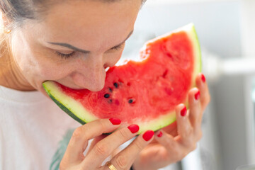 Shot of the woman eating watermelon. Food
