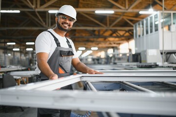 PVC industry worker or operator making frames for windows and doors