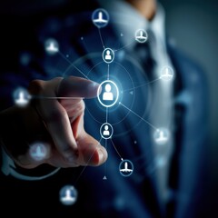 Fototapeta premium Businessman interacting with a digital network interface, connecting people and technology in a futuristic business environment.