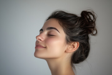 Fototapeta premium A close up of a girl's face with her eyes closed