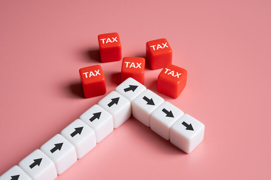 arrow turn down decreasing after engage with red cube tax. Tax expense management concept for business or individual who have high income. Pay tax and revenue decrease. Financial tax planning.