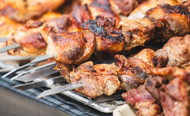 Meat on metal skewers fried on the grill