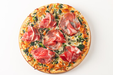 Pizza with prosciutto, ham, arugula, spinach, tomatoes, pesto, cheese and parmesan. Italian cuisine. 