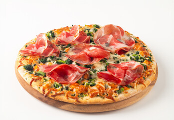 Pizza with prosciutto, ham, arugula, spinach, tomatoes, pesto, cheese and parmesan. Italian cuisine. 