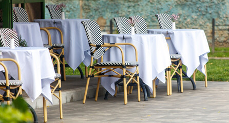 Tables and chairs in a street cafe