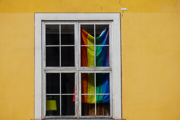 Fototapeta premium Pride and LGBTQ+ flag hanged in a modern European house