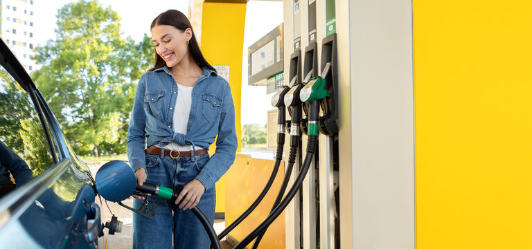 Woman refilling auto with bio fuel at modern petrol station. Eco friendly and convenient car care, automobile fueling offer concept
