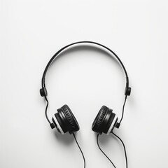 Fototapeta premium Minimalist black wired headphones isolated on a clean white background, perfect for music listening and audio enjoyment. Sleek and modern design.