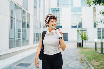 Young caucasian women student going to university at university campus