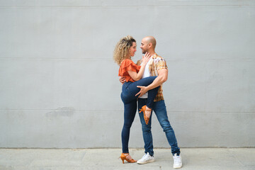 Dancers performing cuban salsa dance routine outdoors