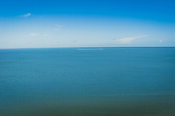 View from a drone of the Vistula Lagoon on a warm summer day. View from the town of Kadyny. Poland.