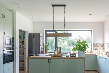 Design indoors architecture in modern kitchen with kitchen island, window and furniture with oven....