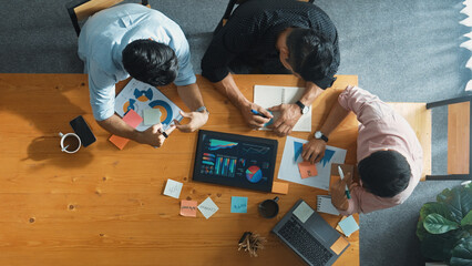Executive manager explain financial graph to colleague at meeting room. Top aerial view of diverse...