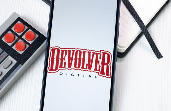 New York, USA - 1 August 2024: Devolver Digital Logo on Phone Screen, Company Icon on Display