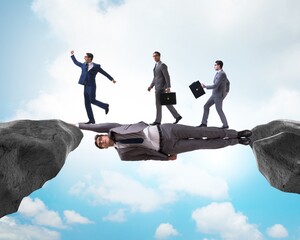 Businessman acting as a bridge in support concept