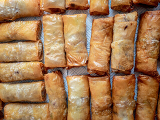Lots of home made crispy spring rolls fried to a perfect golden colour.