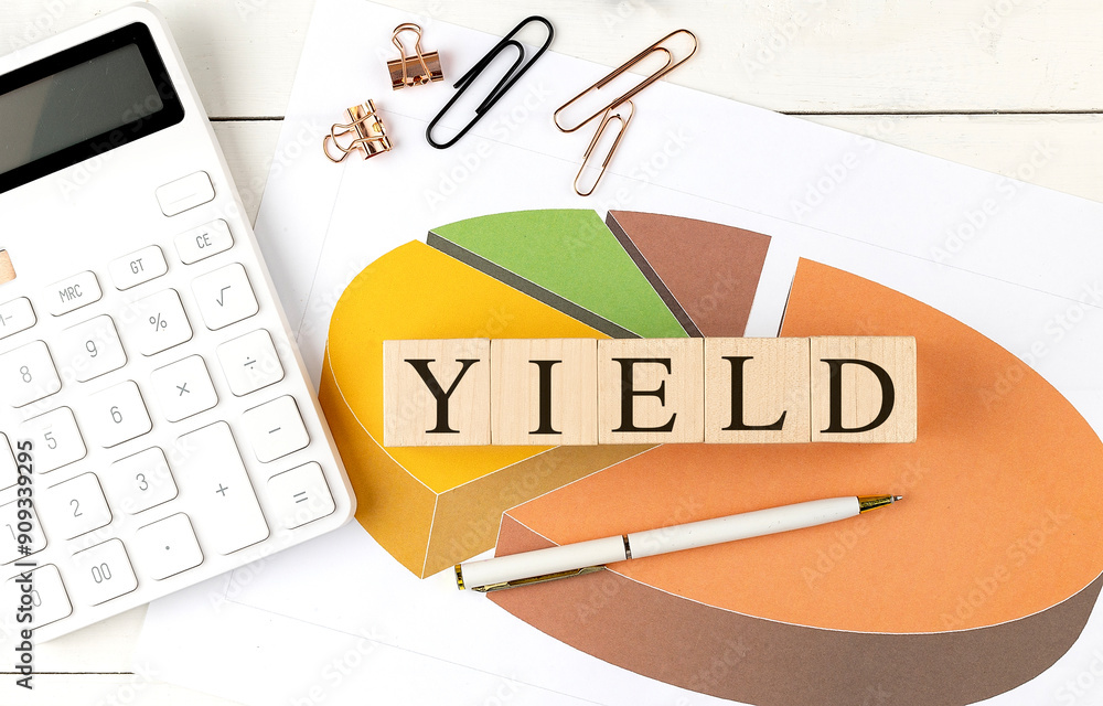 Poster yield word on wooden block on chart background