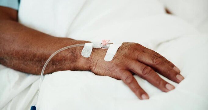 Hand, iv drip and man patient in hospital for surgery recovery with liquid medication for healing. Healthcare, medical and closeup of male person with morphine treatment for pain relief in clinic.