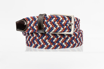 Blue red white Woven braided textile stretch belt isolated on white