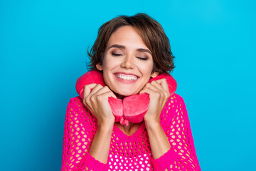 Photo of excited funky lady dressed pink knitted shirt closed eyes relaxing travel auto pillow isolated blue color background