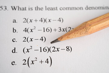Pencil on mathematic formula exercise test paper in education school.