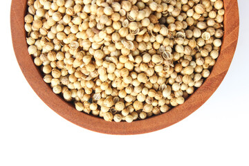 Close Up White pepper seeds or Peppercorns in a wooden bowl isolated on white background. Flat lay