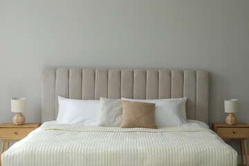 Stylish contemporary bedroom interior with comfortable bed